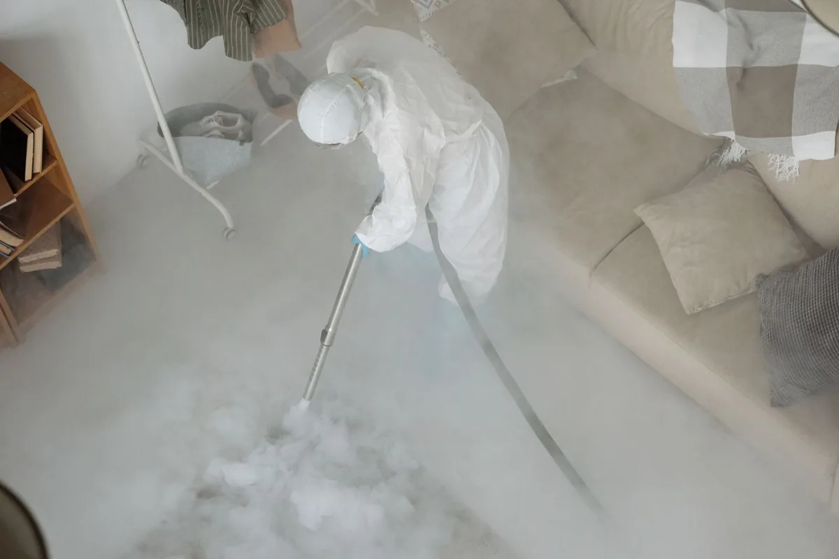 Biohazard cleanup technician in protective equipment, Fifth Ward, LA